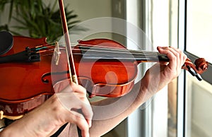 Classical player hands. Details of violin playing