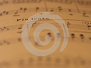 Classical print piano score with piu lento mark photo