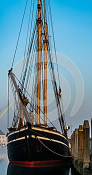 Classical schooner tall ship moored at the dock.