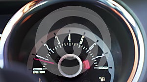 Classical speedometer view on an American muscle car. High RPMs