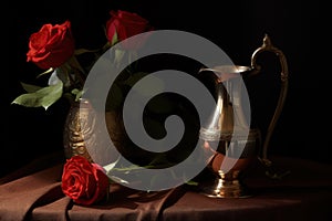 Classical still life with roses in a messing vase photo