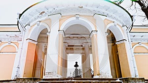 Classical style rotunda color yellow white with ancient Greek ornaments and monumet inside. Rotund in Saint-Petersburg