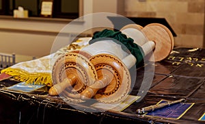 Classical Torah scrolls in a blue case with Hebrew letters. Torah