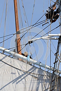 Classical, traditional wooden yacht and sailors on the mast sailing for Bodrum Cup, Turkey