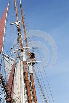 Classical, traditional wooden yacht and sailors on the mast sailing for Bodrum Cup, Turkey