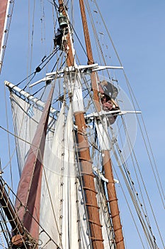 Classical, traditional wooden yacht and sailors on the mast sailing for Bodrum Cup, Turkey