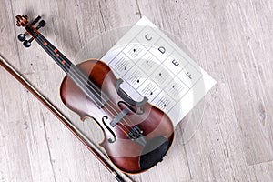 Classical violin with music sheet book