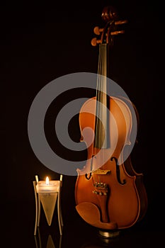 Classical violins with candle
