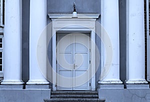 Classical White Double Doors Between Elegant Columns