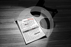 Classified dossier with redactions in a spotlight - Black and white photo