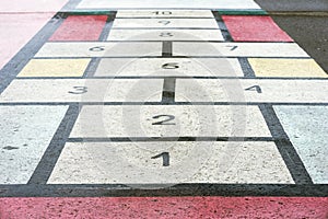 Classiic children game, hopscotch board drawn on asphalt, texture, modern creative background