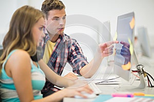 Classmates doing assignment together in the computer room