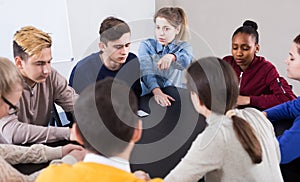 Classmates having round of Werewolf game at break between classes