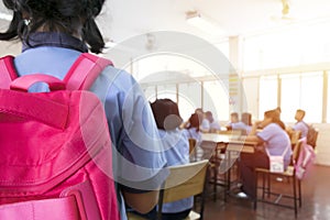 The classroom blur,Girl with red backpack Coming to the classroom