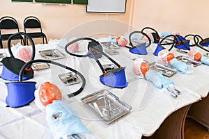 Classroom for tracheotomy. head for tracheotomy practice. Training class on tracheotomy. children and surgeon