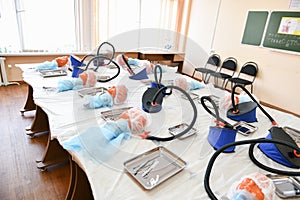 Classroom for tracheotomy. head for tracheotomy practice. Training class on tracheotomy. children and surgeon