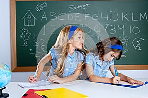 Classroom with two kids students cheating on test