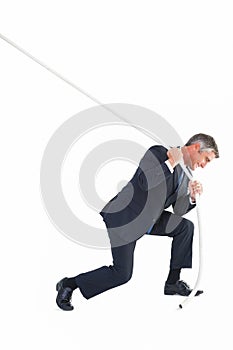 Classy businessman pulling a rope