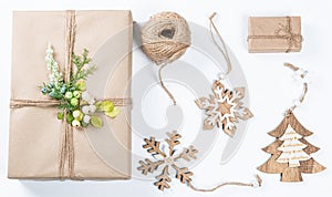 Classy Christmas gifts box presents in brown paper with toys and New Year decor