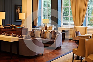 Classy elegant and modern hotel lobby at Amsterdam, The Netherlands in Europe. Seats, tables and lamps at luxury premium hotel.