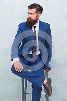 Classy but modern. Businessman sit on chair. Elegant businessman or entrepreneur. Businessman wear formal suit. Brutal