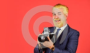 Classy and old school. Manual settings. Photographer with blond beard and mustache. Content creator. Man bearded hipster
