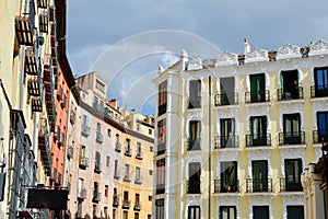 Classy renaissance aged buildings on the other side of Plaza Mayor under vivid sky downtown Madrid, Spain