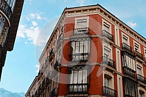 Classy vintage buildings with elegant black metallic balconies in the center of Madrid, Chueca district, Spain photo