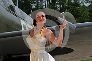 Classy woman with British WWII aircraft