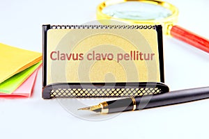 Clavus clavo pellitur. The ancient Greek expression translates as,