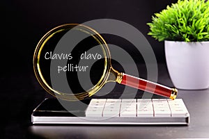 Clavus clavo pellitur. The ancient Greek expression translates as, photo