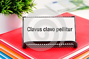 Clavus clavo pellitur. The ancient Greek expression translates as, photo