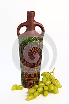 Clay bottle and grapes