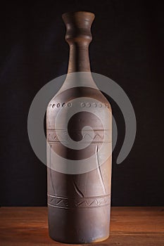 Clay bottle with wine