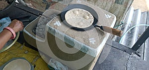 Making bread on clay stove & x28; Indian mud chulha & x29; photo