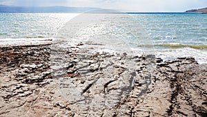 Clay coast of Dead Sea in winter day