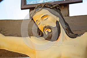 Clay crucifix with the figure of Jesus Christ