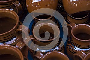 Clay cups in local market stall photo