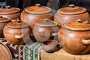 Clay dishes. Crockery made clay. Dishes background