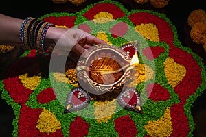 Clay diya lamps lit during diwali celebration, Diwali, or Deepavali, is India\'s biggest and most important holiday