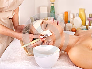 Clay facial mask in beauty spa
