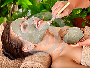 Clay facial mask in beauty spa