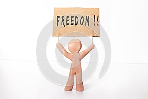 clay figure holding freedom banner