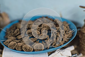 Clay flowers, pieces to make a traditional tree of life, typical Mexican crafts