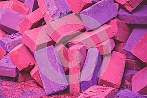 Clay handmade bricks. Bright magenta purple colored