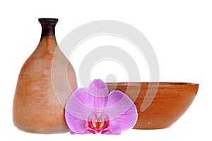 Clay jag and dish with nice orchid