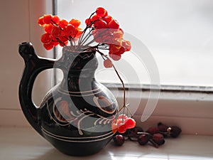 Clay jug with red Rowan