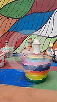 The clay kettles are painted in beautiful colors
