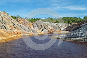 Clay mountains on the shore of the lake. Ural  refractory clay quarries