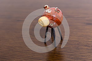 Clay pig decoration on a table.